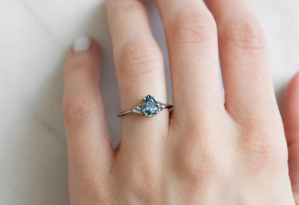 The Ivy Ring with a Pear-Cut Montana Sapphire on Model
