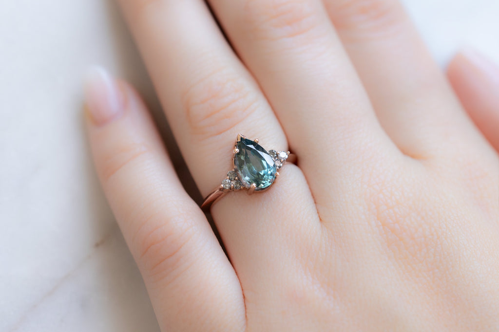 The Ivy Ring with a Pear-Cut Montana Sapphire on Model