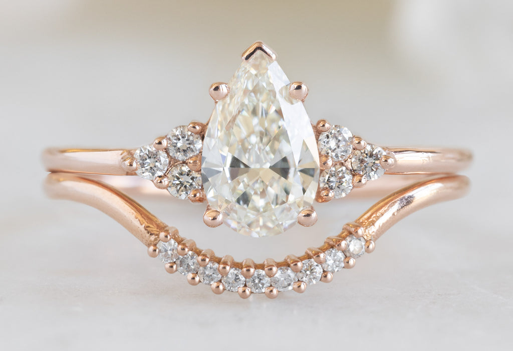 The Ivy Ring with a Pear-Cut White Diamond with White Diamond Pavé Arc Stacking Band