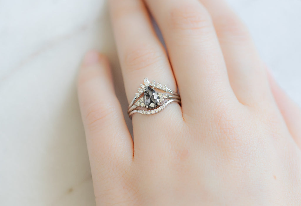 The Ivy Ring with a Rose-Cut Black Diamond with White Diamond Stacking Bands on Model