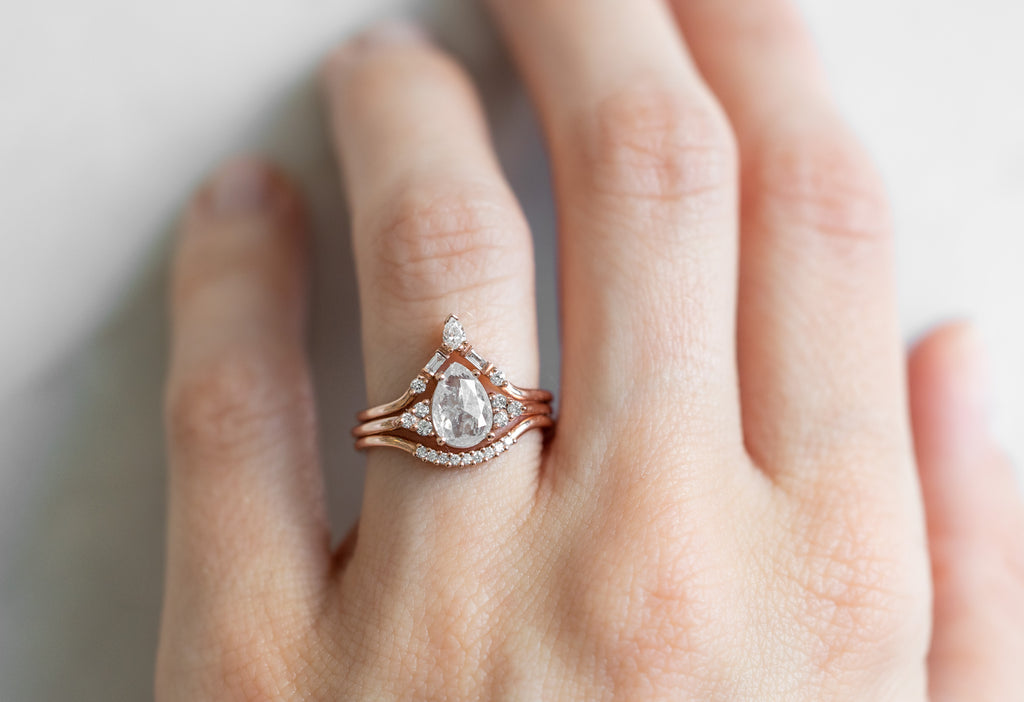 The Ivy Ring with a Rose-Cut Opalescent Diamond with Stacking Bands on Model