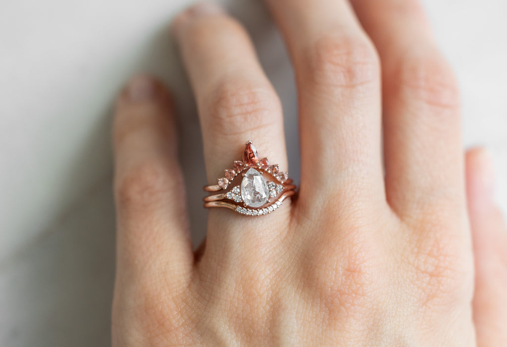 The Ivy Ring with a Rose-Cut Opalescent Diamond with Stacking Bands on Model