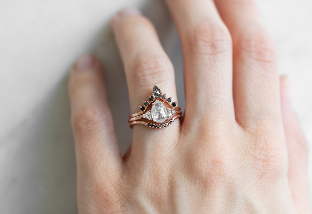 The Ivy Ring with a Rose-Cut Opalescent Diamond with Stacking Bands on Model