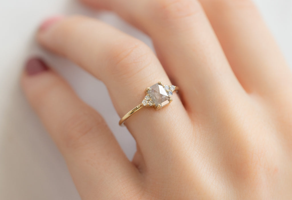 The Ivy Ring with an Emerald-Cut Icy White Diamond on Model