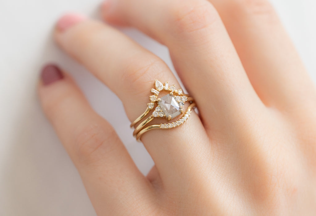 The Ivy Ring with an Emerald-Cut Icy White Diamond with White Diamond Stacking Bands on Model