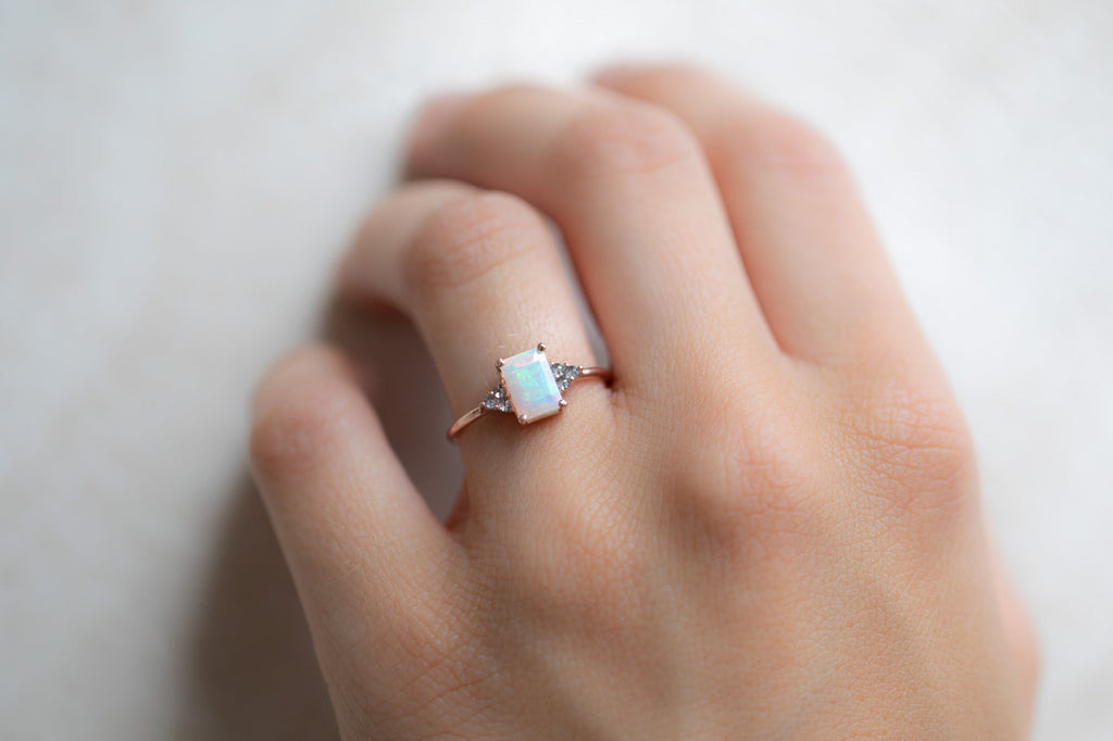 The Ivy Ring with an Emerald Cut Opal on Model