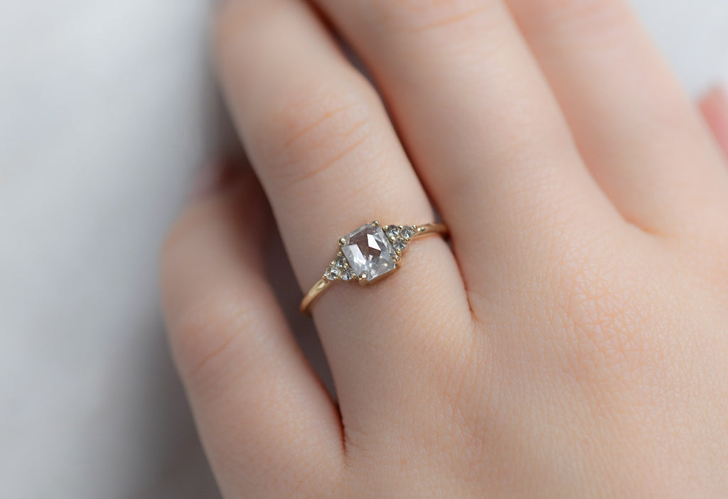 The Ivy Ring with an Emerald-Cut Opalescent Diamond on Model