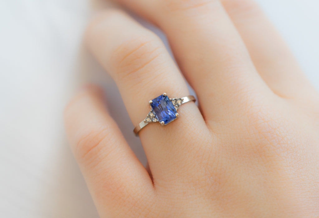The Ivy Ring with an Emerald-Cut Sapphire on Model
