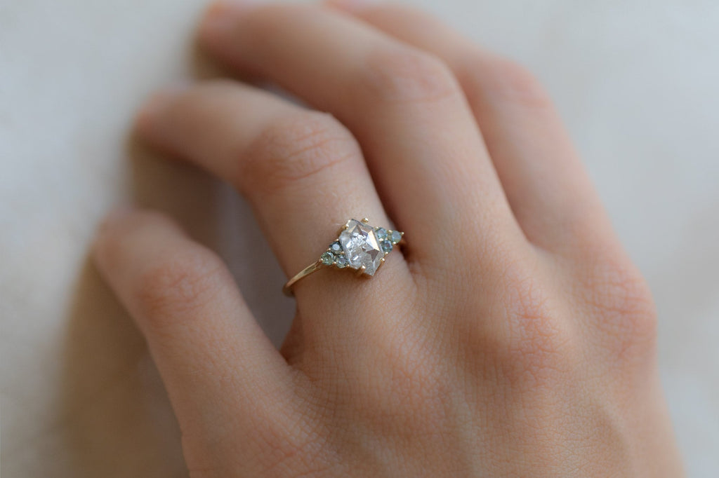 The Ivy Ring with an Icy White Hexagon Diamond + Montana Sapphires On Model