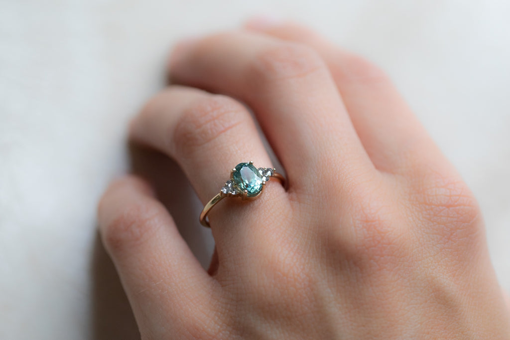 The Ivy Ring with an Oval-Cut Montana Sapphire On Model