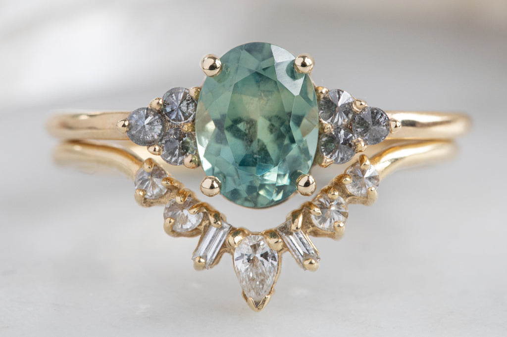 The Ivy Ring with an Oval-Cut Montana Sapphire With Stacking Bands