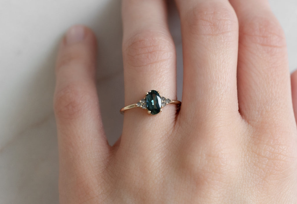 The Ivy Ring with an Oval-Cut Montana Sapphire on Model