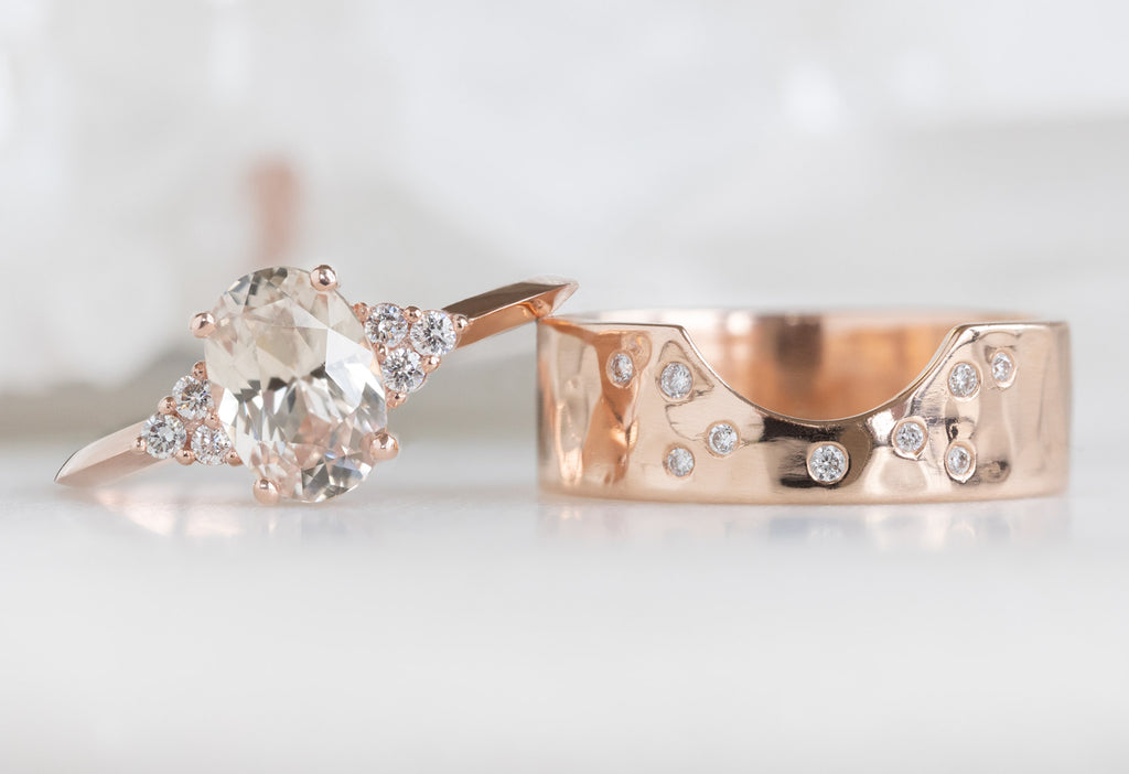 The Ivy Ring with an Oval-Cut Peach Sapphire with Constellation Cut-Out Stacking Band