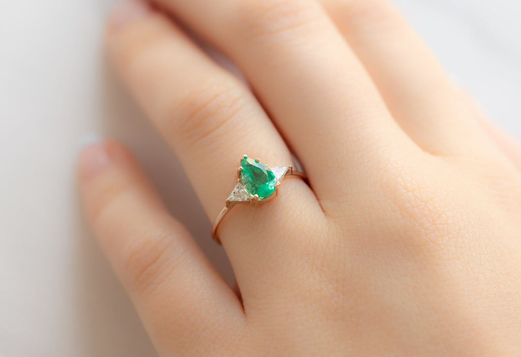 The Jade Ring with a Pear-Cut Emerald on Model