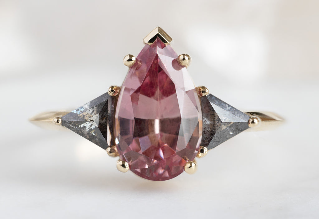 The Jade Ring with a Pear-Cut Malaya Garnet