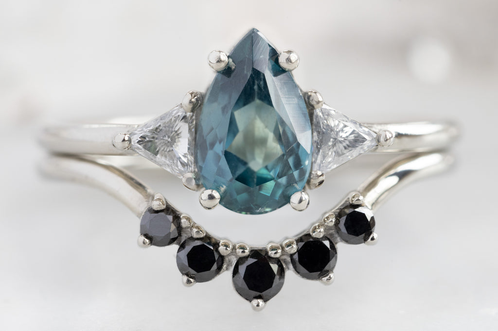 The Jade Ring with a Pear-Cut Montana Sapphire with Black Diamond Stacking Band