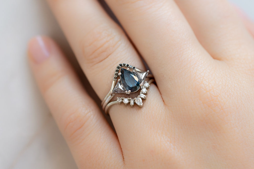 The Jade Ring with a Pear-Cut Sapphire with Stacking Bands on Model