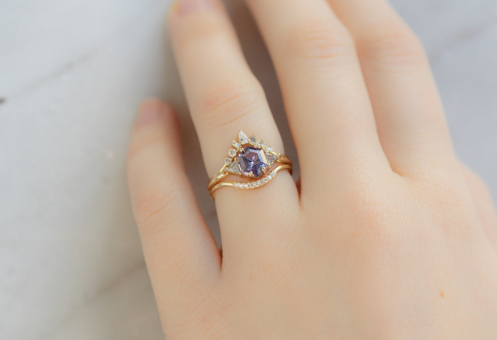 The Jade Ring with a Violet Sapphire with Stacking Bands on Model