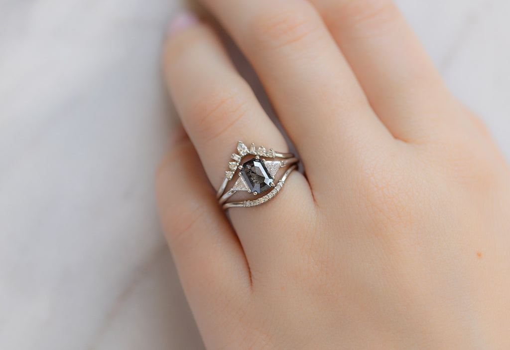 The Jade Ring with an Emerald-Cut Black Diamond with White Diamond Stacking Bands on Model