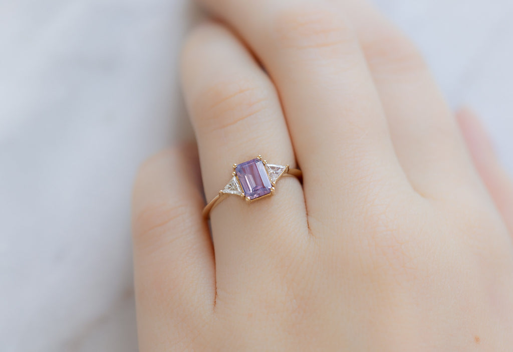The Jade Ring with an Emerald-Cut Orchid Sapphire on Model