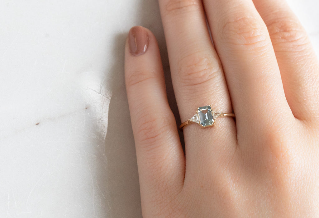 The Jade Ring with an Emerald-Cut Sapphire on MOdel