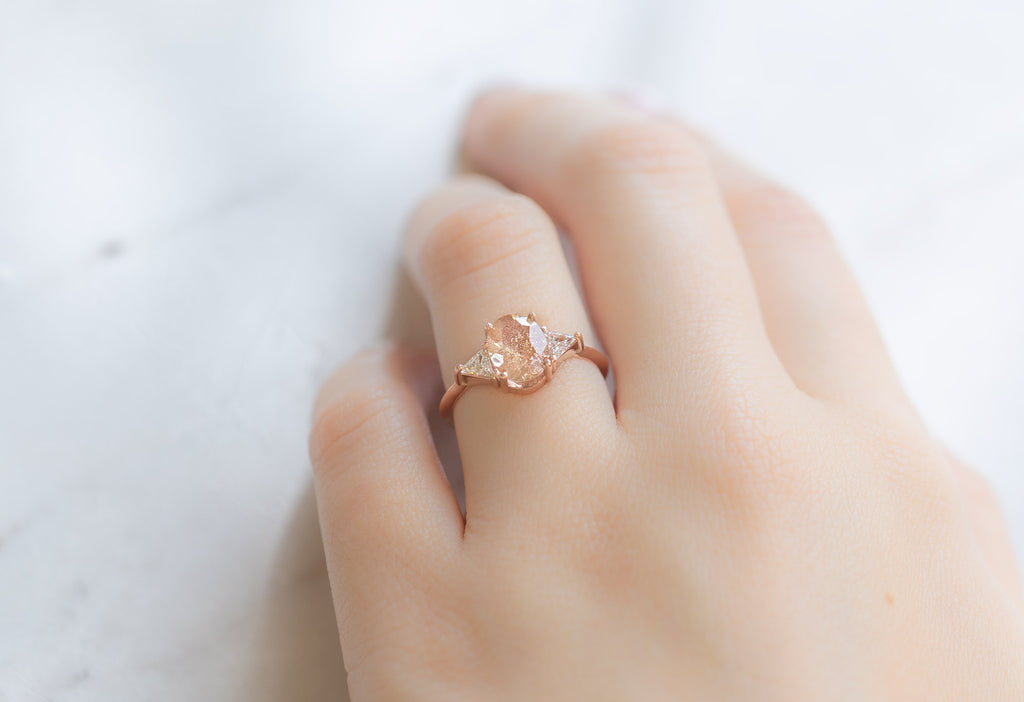 The Jade Ring with an Oval-Cut Sunstone on Model