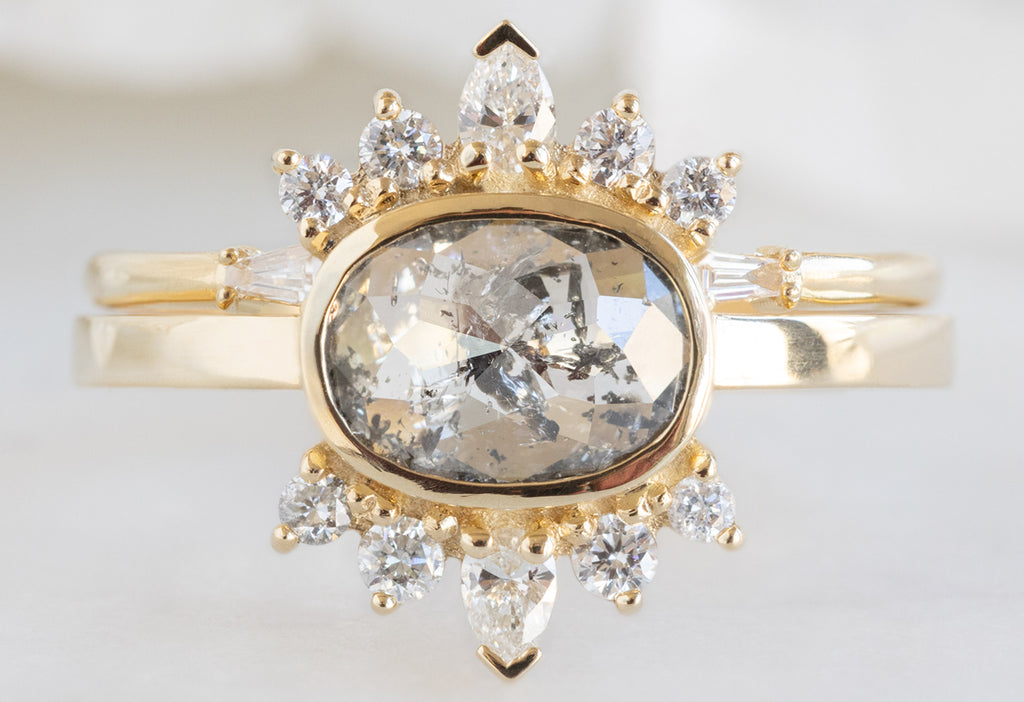 The Lotus Ring with an Oval-Cut Salt and Pepper Diamond with Open Cuff Diamond Baguette Stacking Band