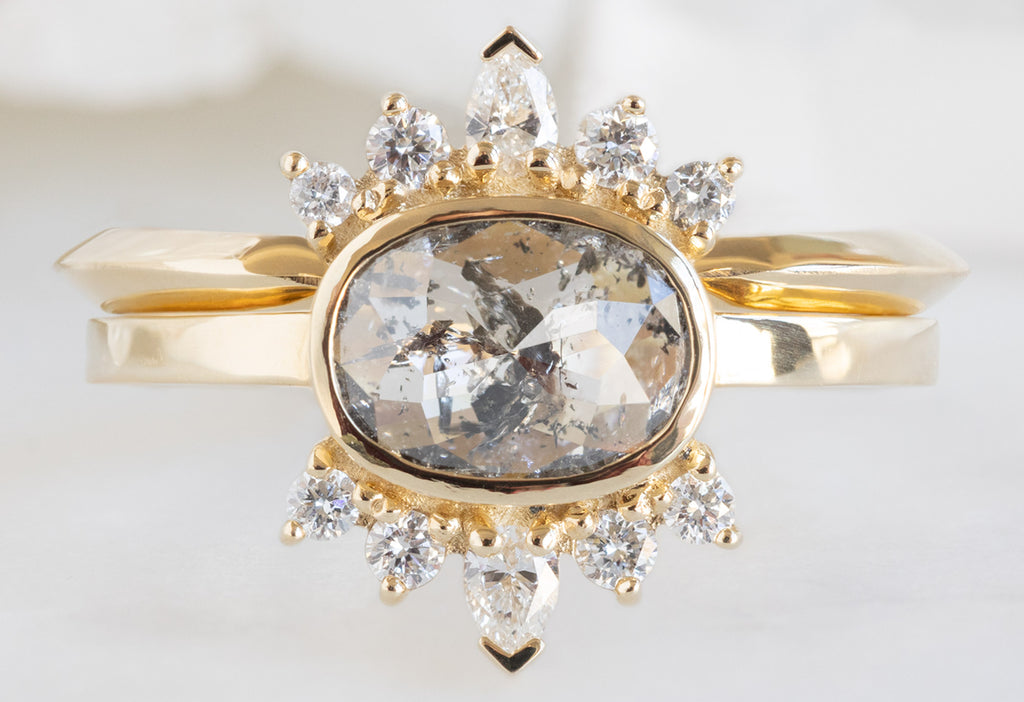 The Lotus Ring with an Oval-Cut Salt and Pepper Diamond with Open Cuff Knife Edge Stacking Band
