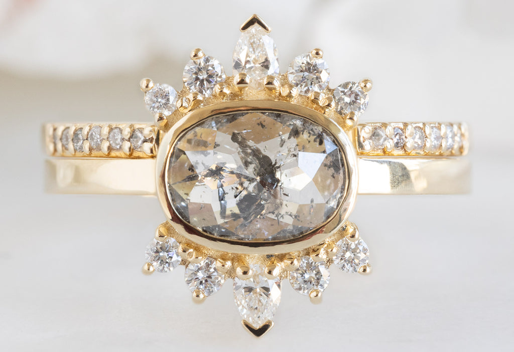 The Lotus Ring with an Oval-Cut Salt and Pepper Diamond with Open Cuff Pavé Diamond Stacking Band