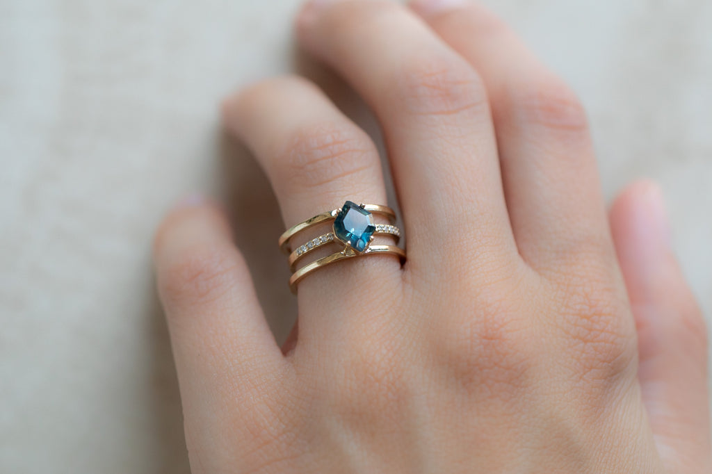 The Poppy Ring with a Montana Sapphire Hexagon with Stacking Band on Model