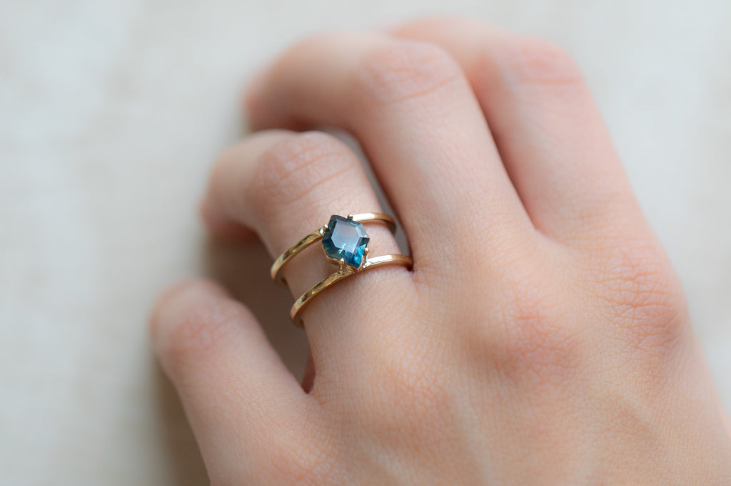 The Poppy Ring with a Montana Sapphire Hexagon on Model