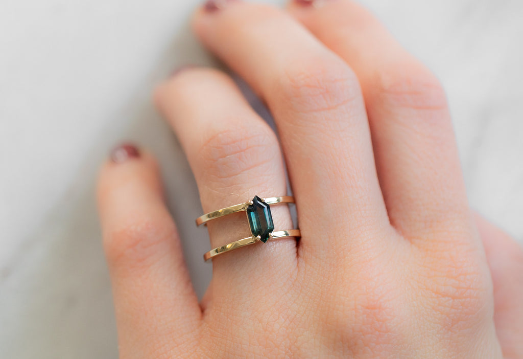 The Poppy Ring with a Sapphire Hexagon on Model