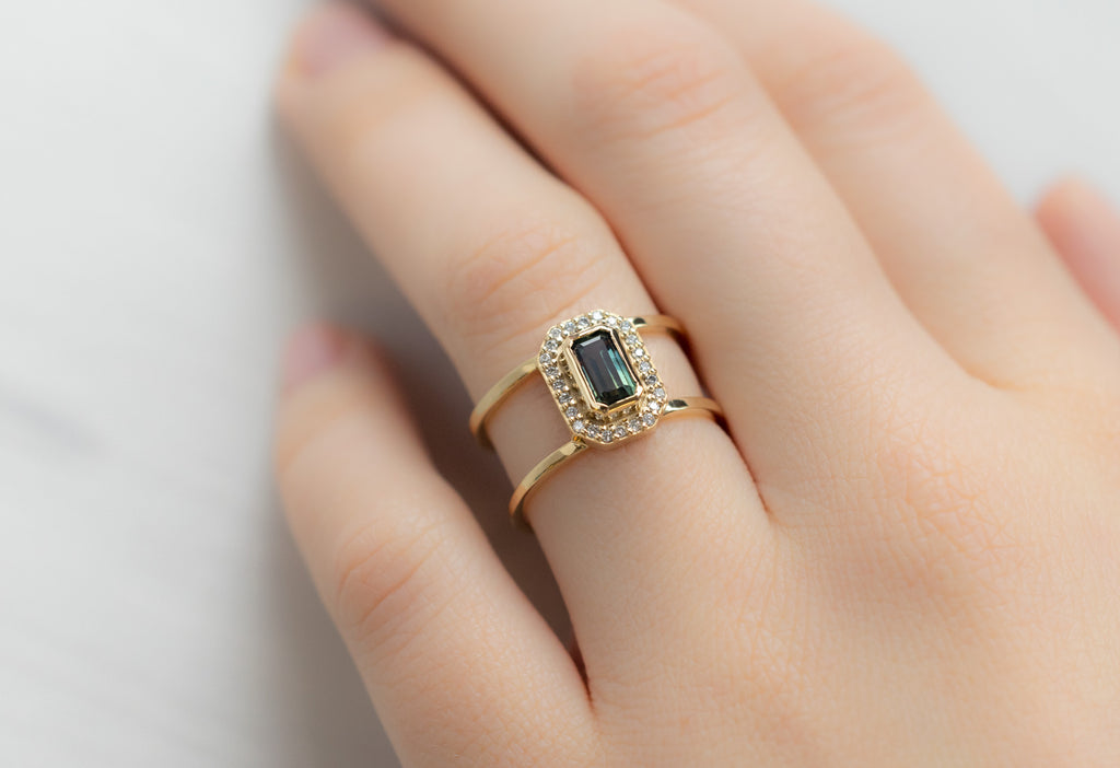 The Poppy Ring with an Emerald-Cut Montana Sapphire on MOdel