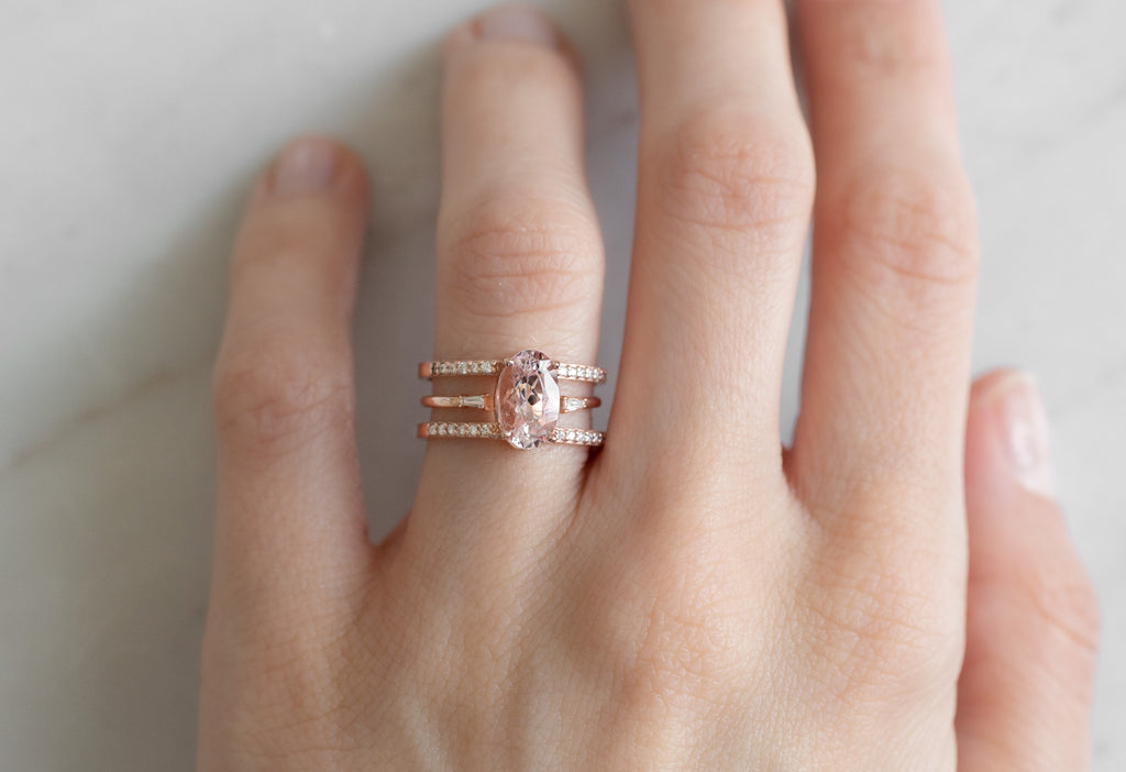 The Poppy Ring with an Oval Cut Morganite Ring with Stacking Band on Model