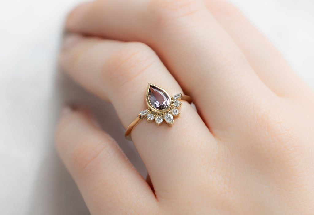 The Posy Ring with a Pear-Cut Tanzanite on Model