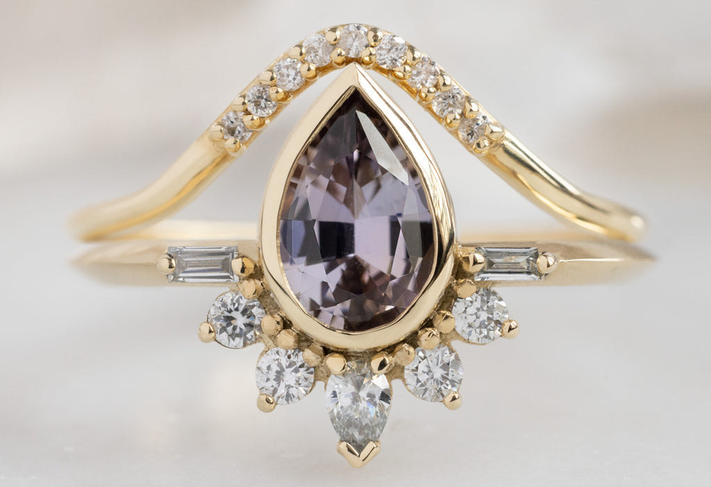 The Posy Ring with a Pear-Cut Tanzanite with Pavé Peak Stacking Band
