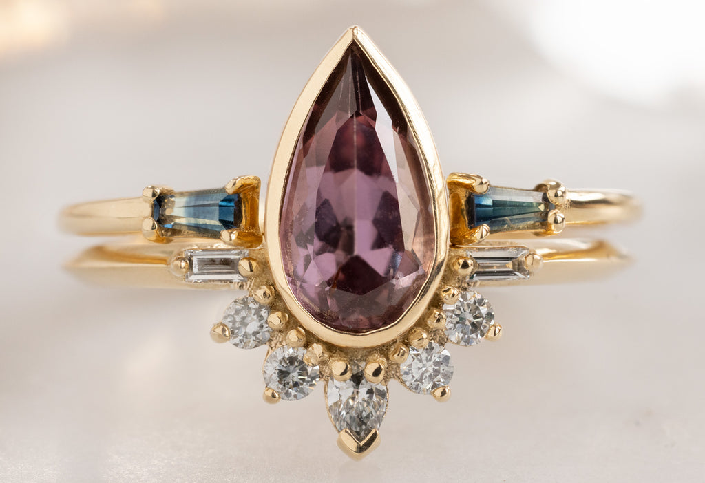 The Posy Ring with a Pear-Cut Violet Sapphire with Open Cuff Montana Sapphire Baguette STacking Band