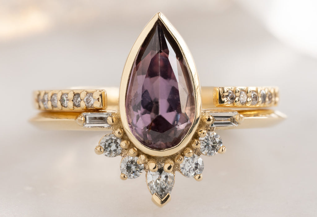 The Posy Ring with a Pear-Cut Violet Sapphire with Open Cuff Pavé Stacking Band
