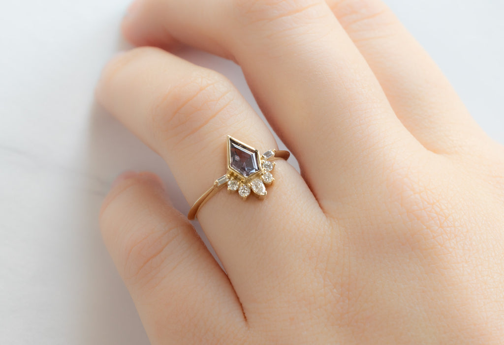 The Posy Ring with a Shield-Cut Violet Sapphire on Model