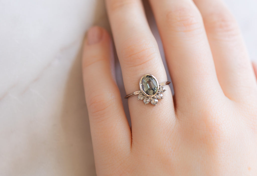 The Posy Ring with an Oval-Cut Tanzanite on Model