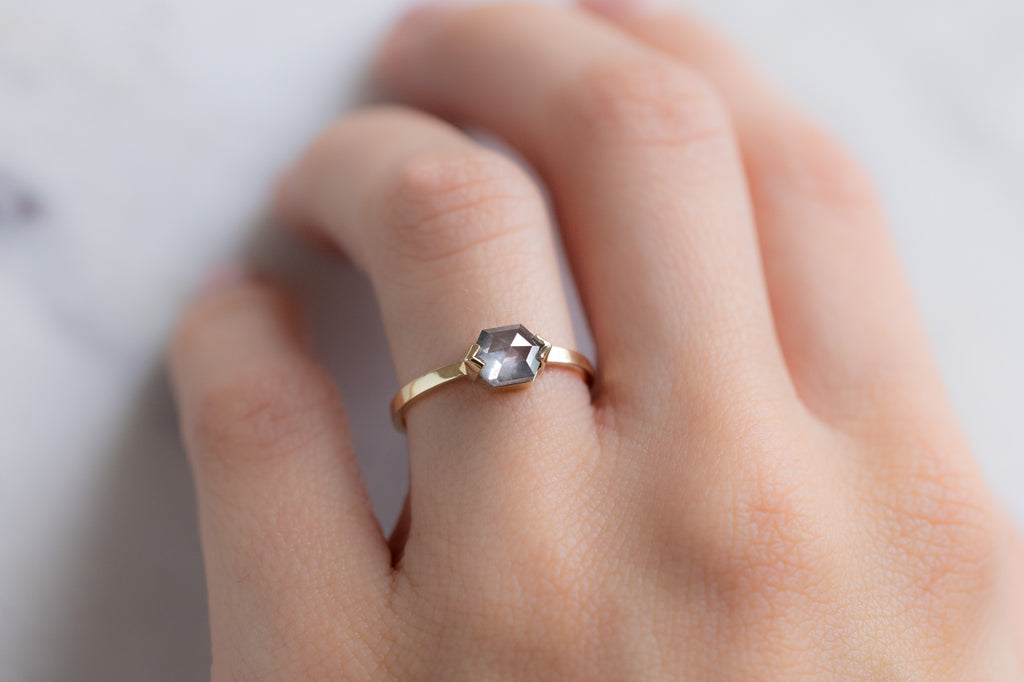 The Sage Ring with a Opalescent Grey Hexagon Diamond on Model