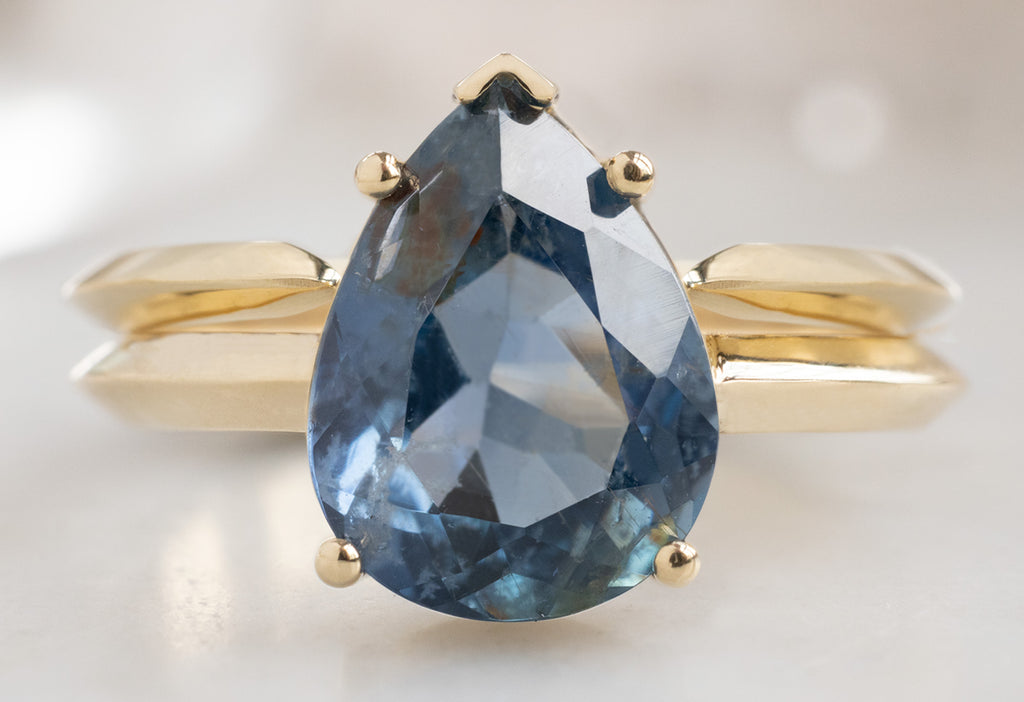 The Sage Ring with a Pear-Cut Sapphire with Open Cuff Knife Edge Stacking Band