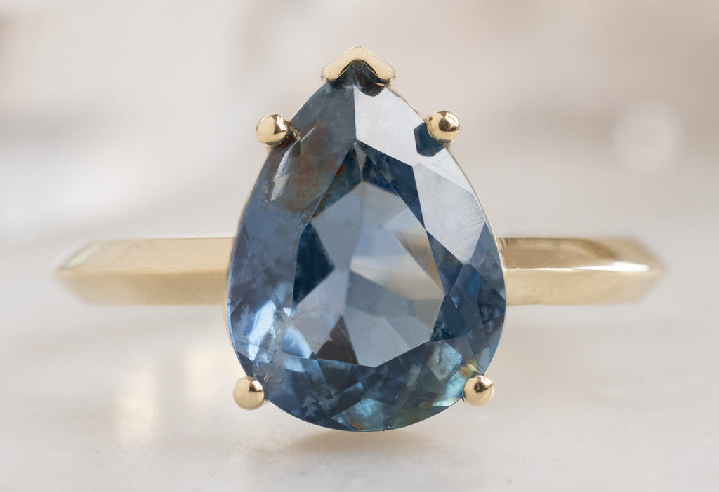 The Sage Ring with a Pear-Cut Sapphire
