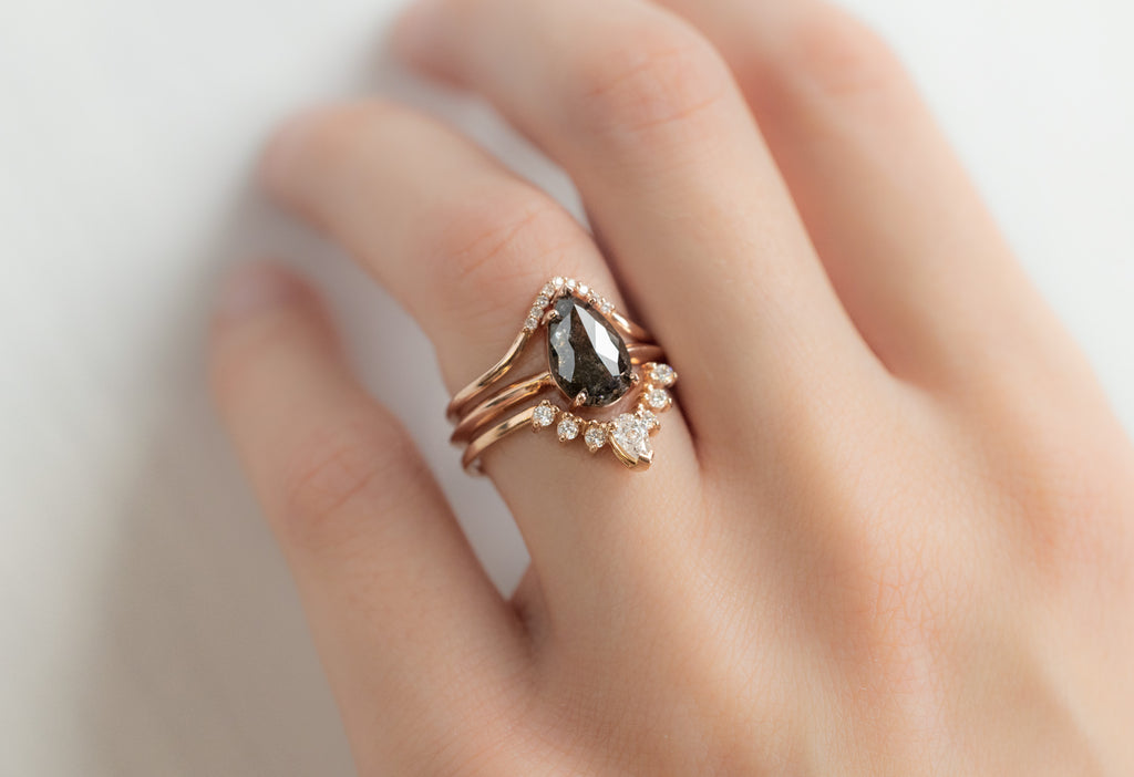 The Sage Ring with a Rose-Cut Black Diamond with White Diamond Stacking Bands on Model