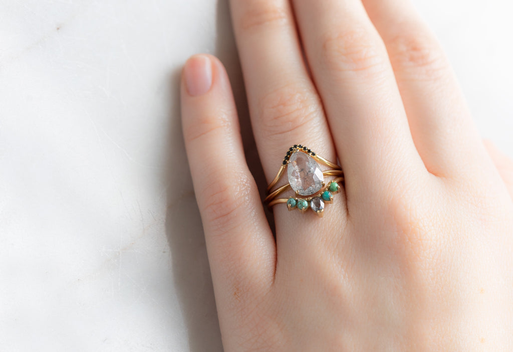 The Sage Ring with a Rose-Cut Icy White Diamond with Stacking Bands on Model
