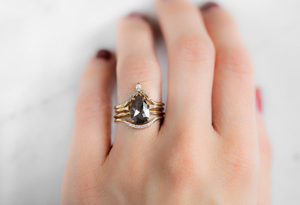 The Sage Ring with a Rose-Cut Salt and Pepper Diamond with Stacking Bands on Model