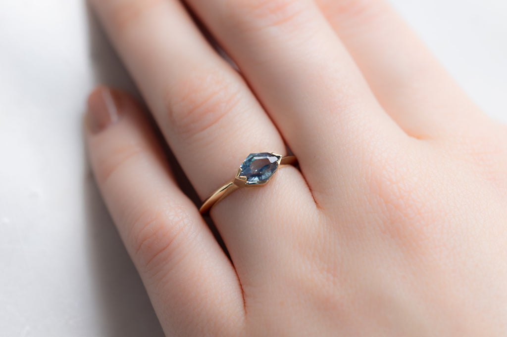 The Sage Ring with an Artisan-Cut Sapphire on Model