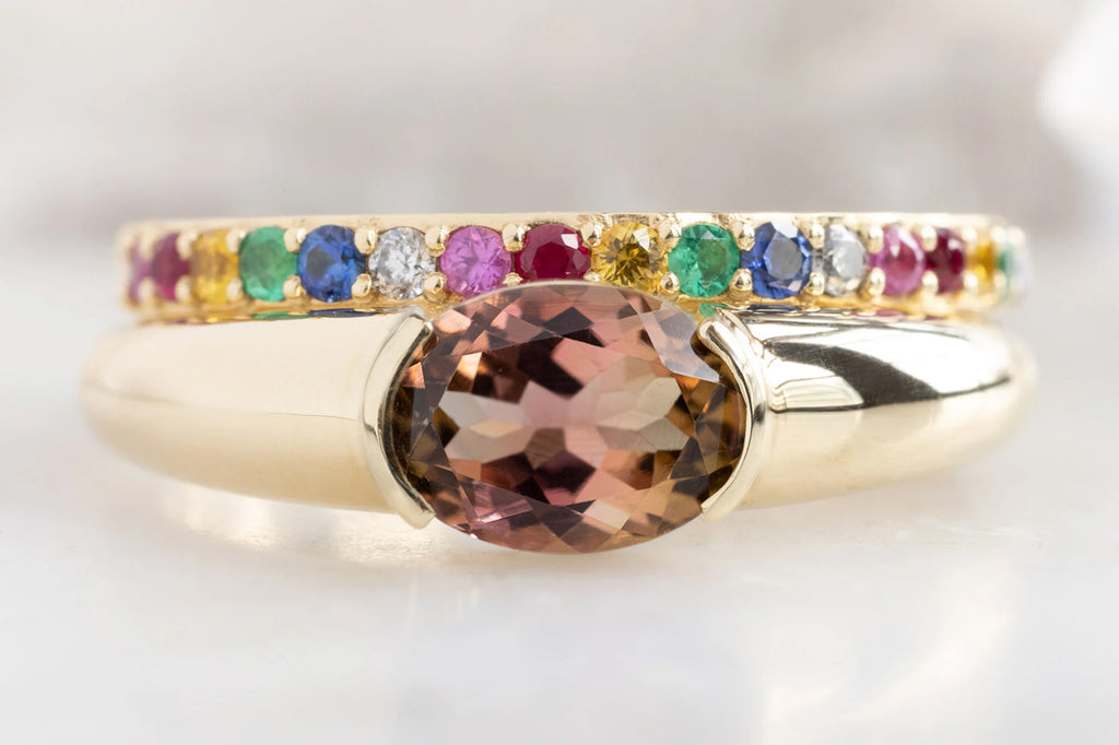 The Signet Ring with an Oval-Cut Bicolor Tourmaline with Rainbow Sapphire Pavé Stacking Band