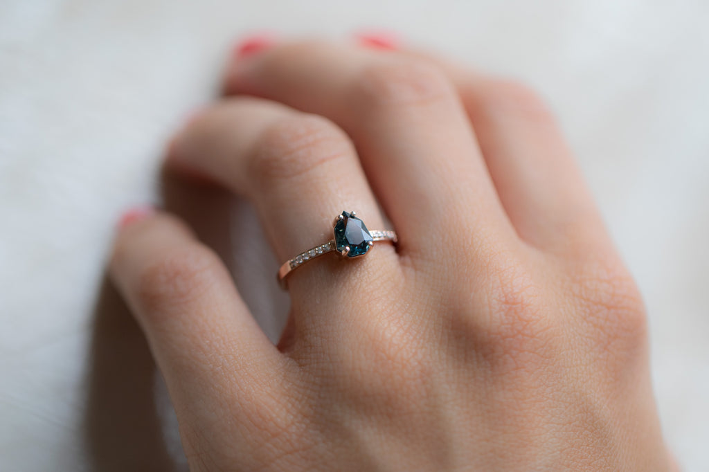 The Willow Ring with a Shield Cut Sapphire on model