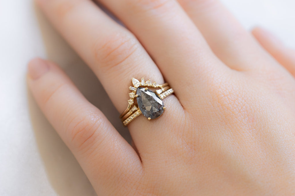 The Willow Ring with a Black Rose-Cut Diamond with White Diamond Stacking Bands on Model